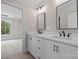 Bright bathroom featuring a double vanity, modern fixtures, and access to the bedroom at 537 Riddle Mill Rd, Clover, SC 29710