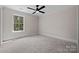 Clean bedroom with carpeted floors, a ceiling fan, and a window at 537 Riddle Mill Rd, Clover, SC 29710