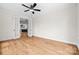 View of a bedroom with hardwood floors and white trim, connecting to the kitchen through French doors at 537 Riddle Mill Rd, Clover, SC 29710