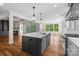 Open-concept kitchen with central island, stainless steel appliances, and seamless flow to living spaces at 537 Riddle Mill Rd, Clover, SC 29710