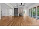 Bright living room with hardwood floors, stone fireplace, built-in shelving, and backyard access at 537 Riddle Mill Rd, Clover, SC 29710