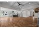 Open layout living space with hardwood floors that seamlessly blends the kitchen and living room at 537 Riddle Mill Rd, Clover, SC 29710