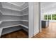Spacious walk-in pantry with custom shelving adjacent to the gourmet kitchen at 537 Riddle Mill Rd, Clover, SC 29710
