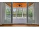 A covered patio with ceiling fan, wood ceiling, and access to the outdoors via sliding glass doors at 537 Riddle Mill Rd, Clover, SC 29710