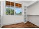Bright walk-in closet with custom shelving and a large window with a wooded view at 537 Riddle Mill Rd, Clover, SC 29710