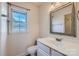Bathroom features a white toilet, modern sink fixtures, and a large framed mirror at 5941 Quail Hollow Rd # F, Charlotte, NC 28210