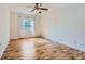 Bedroom with light wood floors, neutral walls, white trim, and ample natural light at 5941 Quail Hollow Rd # F, Charlotte, NC 28210