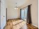 Dining area featuring hardwood floors, a chandelier, and sliding glass doors with views of the outdoor area at 5941 Quail Hollow Rd # F, Charlotte, NC 28210