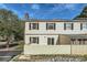 Exterior home view with vinyl siding, dark shutters, and well-maintained lawn and landscaping at 5941 Quail Hollow Rd # F, Charlotte, NC 28210