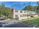 Exterior view of the home shows the backyard, parking and landscaping at 5941 Quail Hollow Rd # F, Charlotte, NC 28210