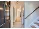 Inviting home foyer with wood floors, stairs to the upper level, and a view into the living area at 5941 Quail Hollow Rd # F, Charlotte, NC 28210