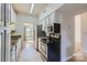 Modern kitchen featuring stainless steel appliances, granite counters, and white cabinetry at 5941 Quail Hollow Rd # F, Charlotte, NC 28210