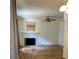 Living room featuring a decorative fireplace, hardwood floors, and an art piece over the mantel at 5941 Quail Hollow Rd # F, Charlotte, NC 28210