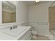 Bathroom features a large mirror and a shower with tile walls at 6117 Yellowood Rd, Charlotte, NC 28210