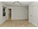 Spacious bedroom with neutral carpet, natural light, and en-suite bathroom at 6117 Yellowood Rd, Charlotte, NC 28210