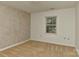 Neutral bedroom featuring carpet, a window with blinds, and an overhead light at 6117 Yellowood Rd, Charlotte, NC 28210