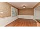 Elegant dining room with hardwood floors, neutral color scheme, and large window at 6117 Yellowood Rd, Charlotte, NC 28210