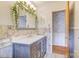 Modern bathroom with stone walls, decorative mirror, and vanity at 617 Oak Grove Rd, Kings Mountain, NC 28086