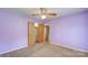 Carpeted bedroom with ceiling fan and access to the en suite bathroom at 617 Oak Grove Rd, Kings Mountain, NC 28086