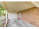 Covered carport area with brick and siding, providing sheltered parking and access to the home at 617 Oak Grove Rd, Kings Mountain, NC 28086