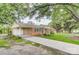 Charming brick home with a well-maintained lawn, covered parking and cozy front porch, offering curb appeal and comfort at 617 Oak Grove Rd, Kings Mountain, NC 28086
