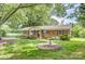 Charming single-story brick home with a covered porch and mature trees in the front yard at 617 Oak Grove Rd, Kings Mountain, NC 28086