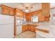 Cozy kitchen with wood cabinets, white appliances and tile flooring at 617 Oak Grove Rd, Kings Mountain, NC 28086
