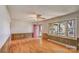 Spacious living room with wood paneling, laminate floors and large window at 617 Oak Grove Rd, Kings Mountain, NC 28086