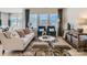 Cozy living room featuring a stylish sofa, accent chairs, and a decorative rug over light wood floors at 6346 Fairfax Ct, Maiden, NC 28650