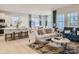 Open-concept living space featuring a sofa, chairs, and a view of the kitchen and dining area, with abundant natural light at 6346 Fairfax Ct, Maiden, NC 28650