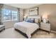 Serene bedroom with a plush bed, soft lighting, and large window offering a peaceful retreat at 6346 Fairfax Ct, Maiden, NC 28650