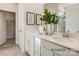 Bathroom featuring double sinks, a large mirror, and neutral decor for a bright and airy feel at 6352 Fairfax Ct, Maiden, NC 28650