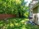Spacious backyard featuring a wood fence and lush greenery, perfect for outdoor activities and enjoying nature at 725 Chelton Ln, Fort Mill, SC 29715