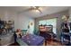Bright bedroom featuring a single bed, ceiling fan, hardwood floors, and ample natural light at 725 Chelton Ln, Fort Mill, SC 29715