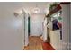 Entryway featuring hardwood style floors, coat rack and staircase at 725 Chelton Ln, Fort Mill, SC 29715