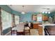 Cozy kitchen with wood cabinets, modern appliances, and a dining table near bright windows at 725 Chelton Ln, Fort Mill, SC 29715