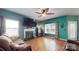 Spacious living room with fireplace, ample natural light, and comfortable seating at 725 Chelton Ln, Fort Mill, SC 29715