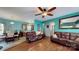 Spacious open-concept living room featuring a ceiling fan and wood floors at 725 Chelton Ln, Fort Mill, SC 29715