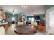 Open-concept living space with kitchen, dining area, and living room with fireplace at 725 Chelton Ln, Fort Mill, SC 29715