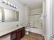 Bathroom showcasing a vanity, toilet, mirror and glass-enclosed shower for a functional and clean space at 7518 Turley Ridge Ln, Charlotte, NC 28273