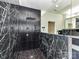 Beautiful bathroom featuring a shower with intricate black tiling and modern fixtures, providing a luxurious experience at 7518 Turley Ridge Ln, Charlotte, NC 28273