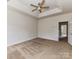 Bright bedroom featuring fresh paint, carpet, a ceiling fan, and recessed ceilings at 7518 Turley Ridge Ln, Charlotte, NC 28273