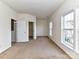 Bright bedroom with neutral carpet, offering natural light from two windows at 7518 Turley Ridge Ln, Charlotte, NC 28273