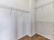 Walk-in closet featuring carpet and multiple shelves for ample storage at 7518 Turley Ridge Ln, Charlotte, NC 28273