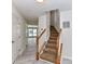 Inviting entryway showcasing the staircase with wood banister and light wood flooring at 7518 Turley Ridge Ln, Charlotte, NC 28273