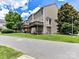 Exterior view showcasing townhouse with multiple decks and well-maintained lawn against a blue sky with clouds at 7518 Turley Ridge Ln, Charlotte, NC 28273