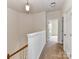 Upstairs hallway featuring fresh paint, carpet, and an open doorway at 7518 Turley Ridge Ln, Charlotte, NC 28273