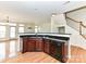 Contemporary kitchen with dark cabinets, granite countertops, and stainless steel dishwasher at 7518 Turley Ridge Ln, Charlotte, NC 28273