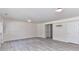 Large open living space with light wood-look floors and ample lighting at 7518 Turley Ridge Ln, Charlotte, NC 28273