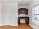 This office features a built-in desk with beautiful dark wood cabinets and granite countertops at 7518 Turley Ridge Ln, Charlotte, NC 28273